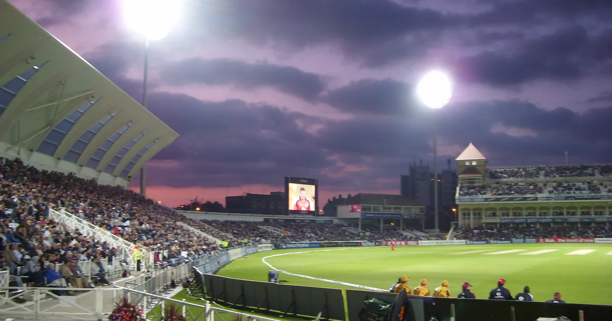 A cricket match under floodlights at Trent Bridge
